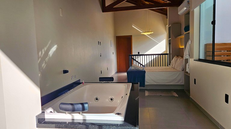 Two-story house with a whirlpool tub and barbecue area near