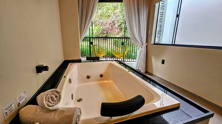 Two-story house with a whirlpool tub and barbecue area near